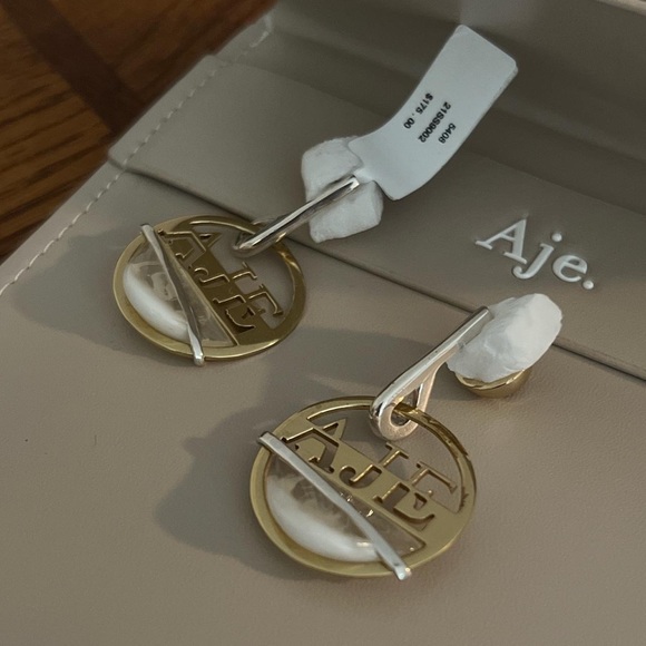Aje Jewelry - AJE Gold Circle Logo Earrings with white resin BNWT